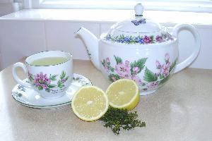 Tea pot, tea and dried lemon thyme