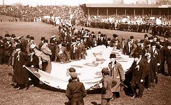 Tigers, American League and city officials in 1908 stretch out the American League Pennant the Tigers won that year