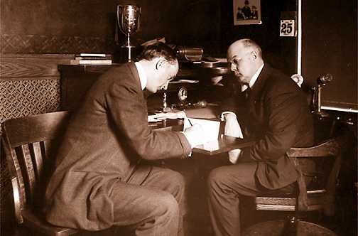 Ty Cobb signs his contract as Tigers owner Frank Navin